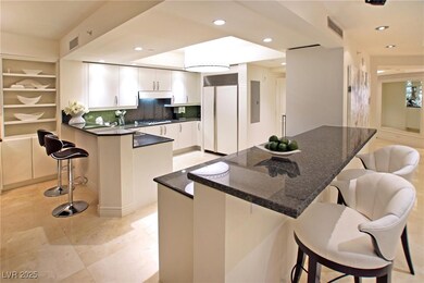 Kitchen featuring recessed lighting, paneled fridg