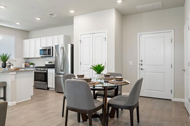 Dining area featuring light wood-style floors, re