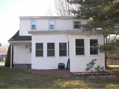 Exterior Back. Fully enclosed porch.