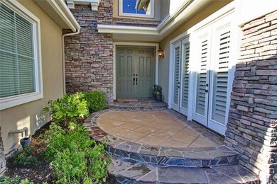 Double door welcoming entry with french doors lead