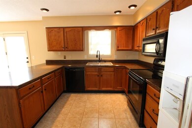 The kitchen has nice tiled floors.