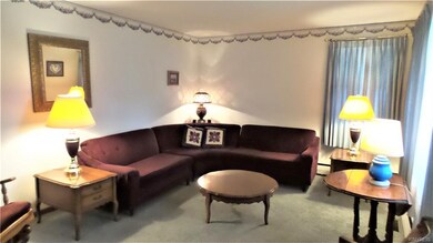 The 17x11 Living Room is carpeted with a bow windo