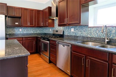 Stainless appliances and eye-popping backsplash.