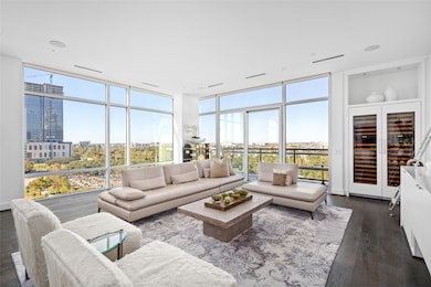 Prepare to be captivated by the breathtaking views of Houston's skyline and verdant green spaces from this exquisite 9th-floor luxury condo at Riva at the Park. Expansive floor-to-ceiling windows flood the space with natural light, seamlessly blending the beauty of the outdoors with the elegance of the interior.