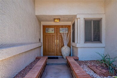 A welcoming double door entrance to this one story
