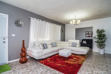 Open living room area with adjacent family/TV room