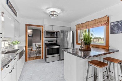 Open kitchen overlooking large backyard