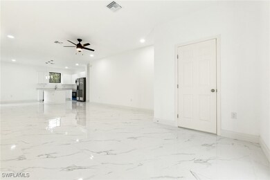 Unfurnished living room with a ceiling fan, recess