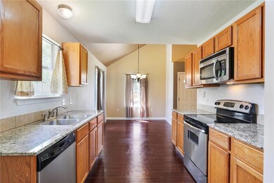 Spacious galley style kitchen with stainless steel
