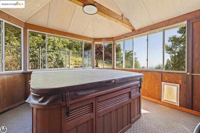 Sunroom with plenty of natural light and vaulted ceiling