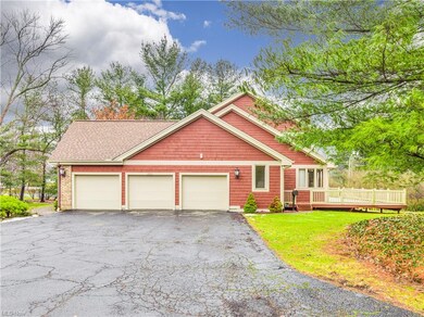 Three car garage with stairs leading into the base