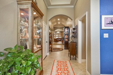 Entry way of the home has very high ceilings.