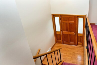 Spacious entry way with hardwoods greets your gues