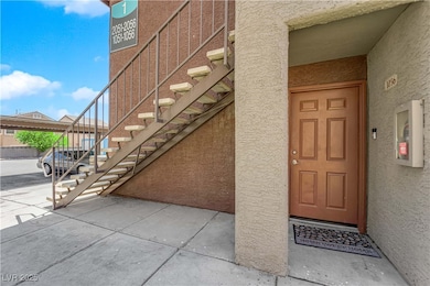 Property entrance with stucco siding
