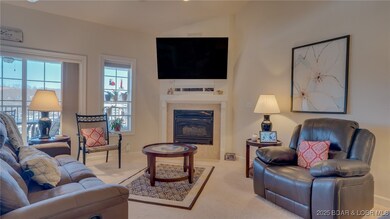 Livingroom with a lake view and fireplace!