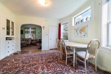Dining area featuring crown molding and wood-type 