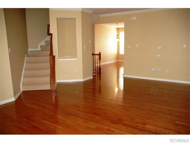 Another view of living room with steps to upper le