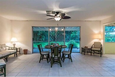 Family room overlooking screened porch and private rear yard.