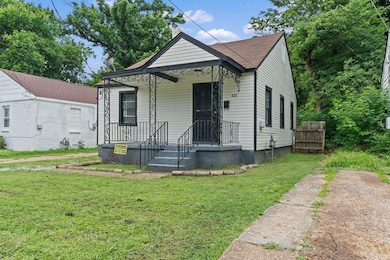 View of front of house with a front lawn and a chimney