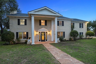 Neoclassical / greek revival house featuring a fr