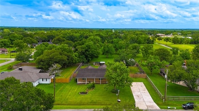 A charming single-story home, the large yard is id
