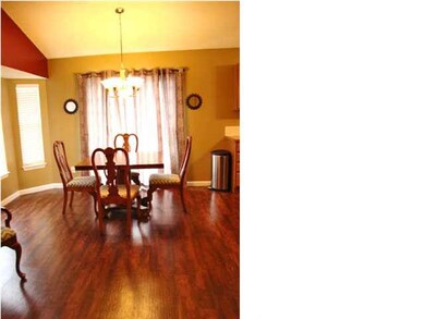 Dining room has bump out area with windows and gla