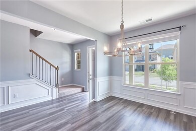 Unfurnished dining area with a chandelier and dark