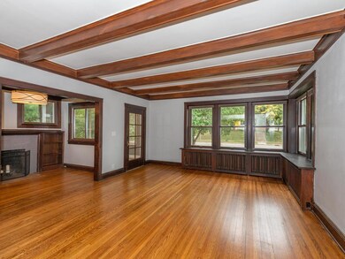 Living Room with beamed ceiling and original hardw