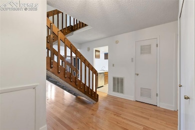 Beautiful hardwood floors invite you into the home