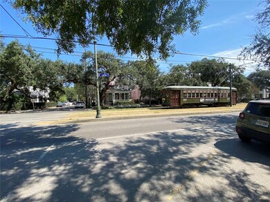STREET CAR PASSES OUT FRONT.