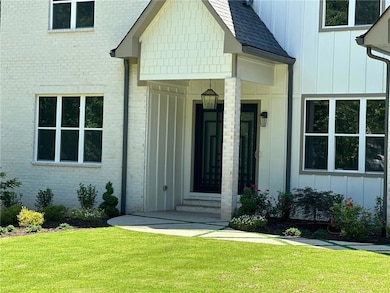 Property entrance with a lawn