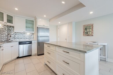Kitchen featuring stainless steel appliances, a si