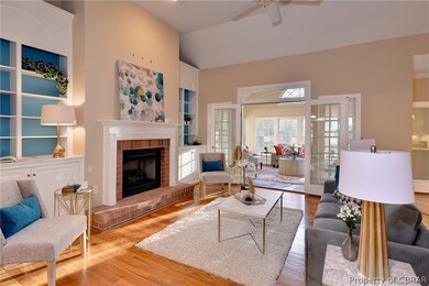 The family room is highlighted by a vaulted ceilin