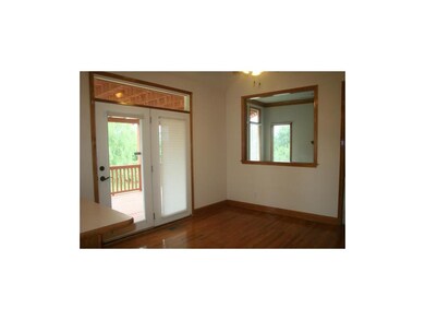 Breakfast area overlooks great room and leads out 