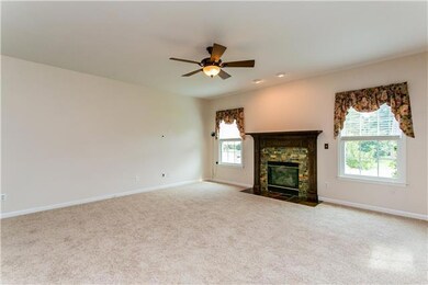 Large den adjacent the kitchen with gas logs!!
