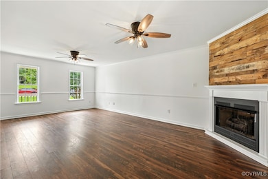 Another view with ceiling fan, a fireplace, Lamina