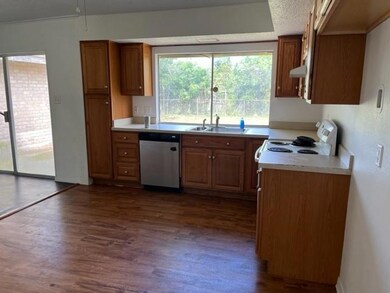 Kitchen with newer cabinets, ss sink, and flooring