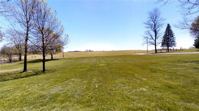 View of the gigantic front yard to the road. Peace and quiet live here. You should too.