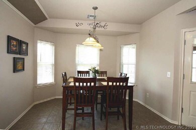 Bayed breakfast nook open to kitchen.