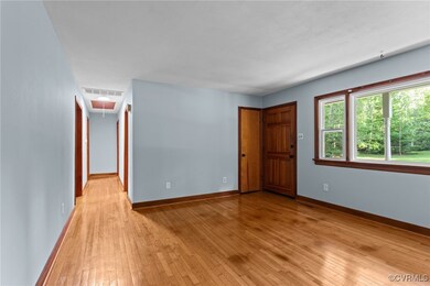 Spare room featuring baseboards, visible vents, at