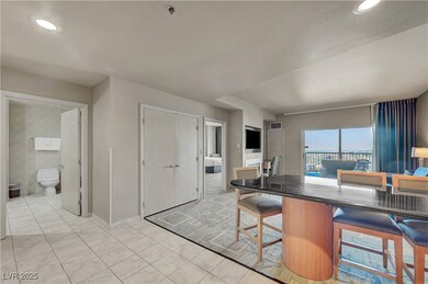 Kitchen with bar chairs around the dining nook