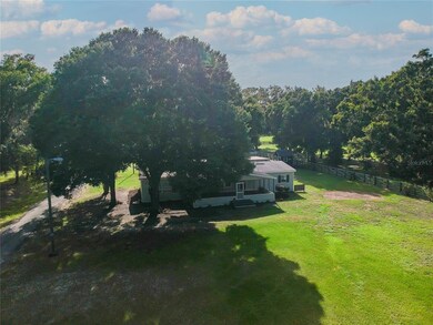 Front view with beautiful oak trees