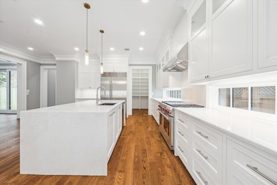 A closer look at the kitchen featuring sleek white