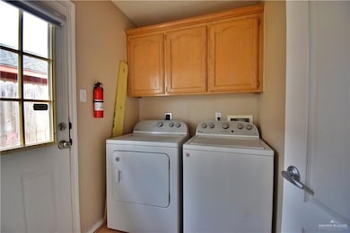 Clothes washing area with separate washer and dryer and cabinet space
