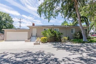 Side of house and garage.