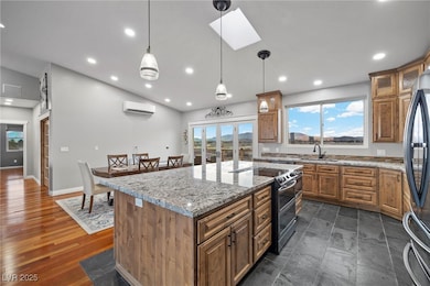 Kitchen with double oven range, fridge, brown cabi
