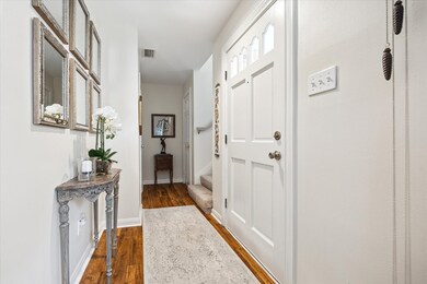 Step inside to a welcoming entry hall with hardwoo