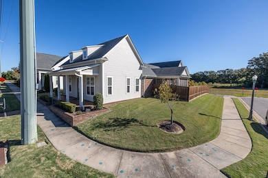 View of side of property featuring a yard