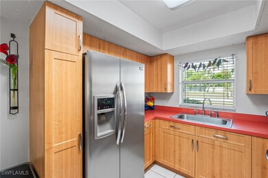 Kitchen with a sink, stainless steel fridge with i