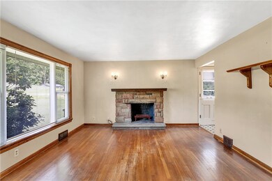 The stone fireplace provides for an attractive foc
